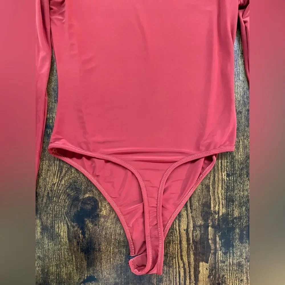 Boohoo Silky orange long sleeve bodysuit
Size 4 - Picture 7 of 8